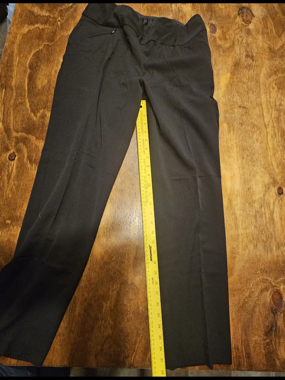 C3, The product is a pair of black dress pants for women by the brand Investment